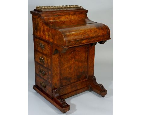 A Victorian burr walnut veneered pop-up Davenport the top with brass three quarter gallery hinged revealing letter compartmen