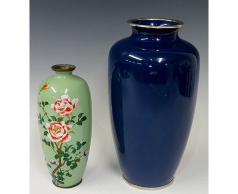 A Japanese cloisonné enamel baluster vase worked in coloured and foil backed enamel with purple and red roses on a pale green