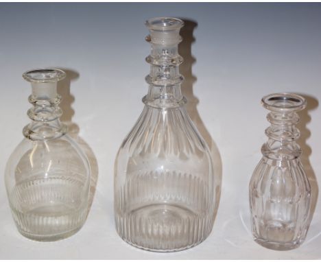 Two Regency mallet shaped decanters, ringed necks and faceted cut bodies, one 24cm high, the other 18cm high; a Victorian mal