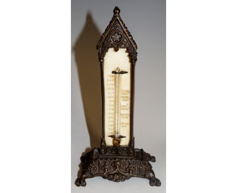 A Victorian small brass Gothic style thermometer with bone register; measurements in Fahrenheit, various known temperatures, 