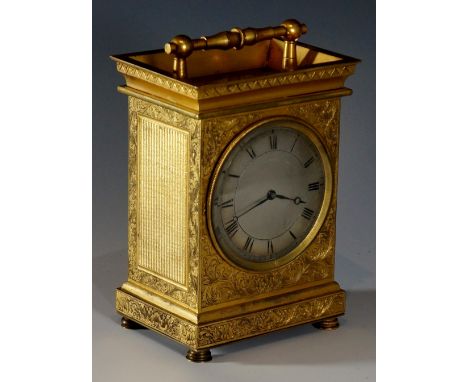 A fine English brass carriage clock the brass case with architectural pediment and post and bale milled handle, the top revea