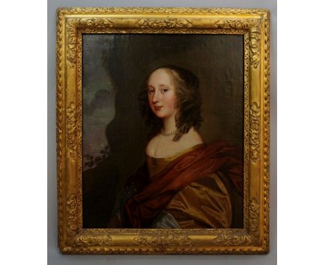 A 17th Century half length portrait of Nell Gwyn, oil on canvas, the reverse stretcher bearing inscription: "Nell Gwyn most c