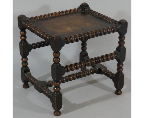 A rectangular stool with panelled top, bobbin turned mouldings, the legs and cross stretchers conforming, 49cm x 43cm, late 1