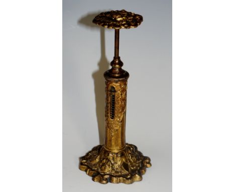 A Victorian gilded brass candlestick style postal weighing scale, top depicting a rose, thistle and three-leaf clovers, beari