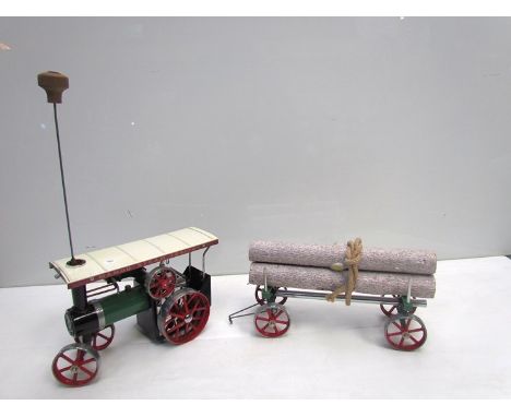 A Mamod live steam tractor with log trailer