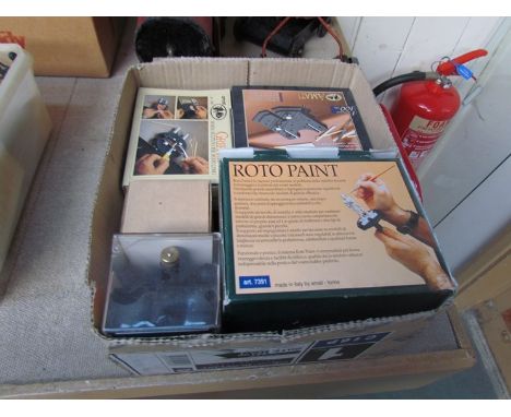 A box containing model makers tools and accessories including gripper and roto paint support and handle 