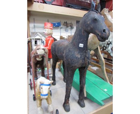 An 18th Century hide covered model horse, 96cms tall 