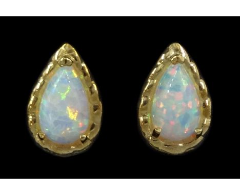 Pair of 9ct gold pear opal stud earrings, stampedCondition Report:Length = 7mm, good condition