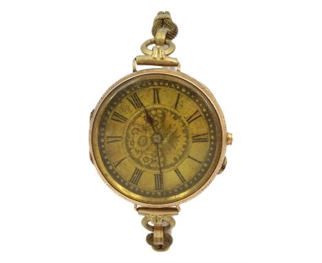 Early 20th century 14ct gold cylinder wristwatch stamped 14K, on gilt metal braceletCondition Report:Approx 27.55gm gross, in