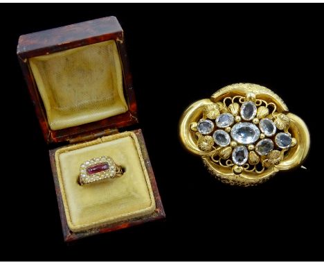 Victorian 9ct gold oval cut blue topaz brooch and a 9ct gold Victorian cabochon garnet and seed pearl ringCondition Report:Ap