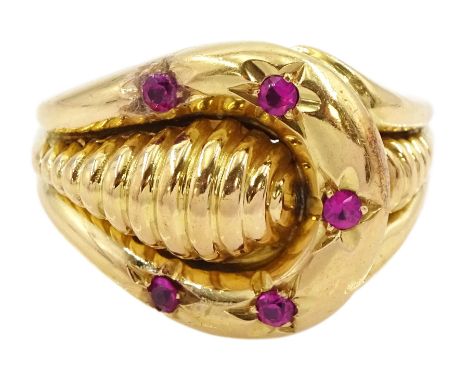 18ct gold pink stone set fancy buckle design ring, stamped 750Condition Report:Approx 7.35gm, tested 18ct size W-X, max depth