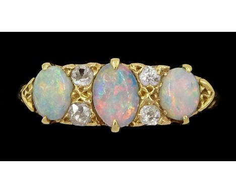 Early 20th century three stone opal and four stone old cut diamond ring Condition Report: Approx 3.25gm, tested 18ct, size N-