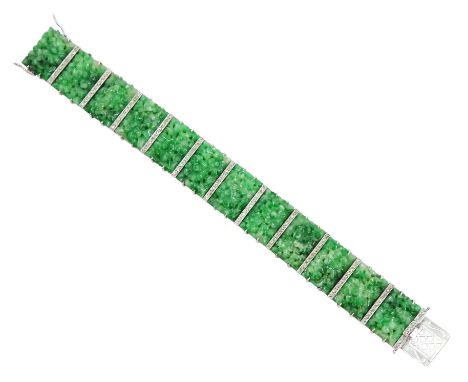 Art Deco platinum and white gold jadeite and diamond bracelet, twelve carved foliate jadeite panels, separated by a row of mi