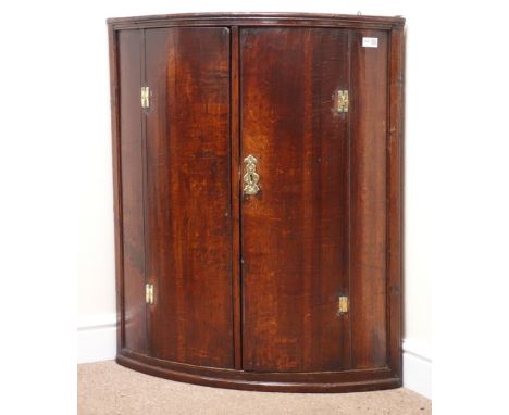 19th century oak wall hanging corner cupboard, two doors enclosing single shelf, W79cm, H92cm, D47cm Condition Report Only on