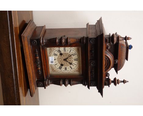 Victorian walnut architectural cased mantel clock, square dial marked Junghans, twin train movement striking the hours on a g