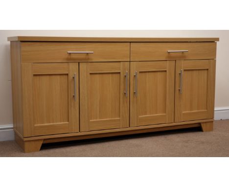 Light oak finish sideboard, two drawers above four cupboards, W164cm, H78cm, D41cm Condition Report Click here for further im