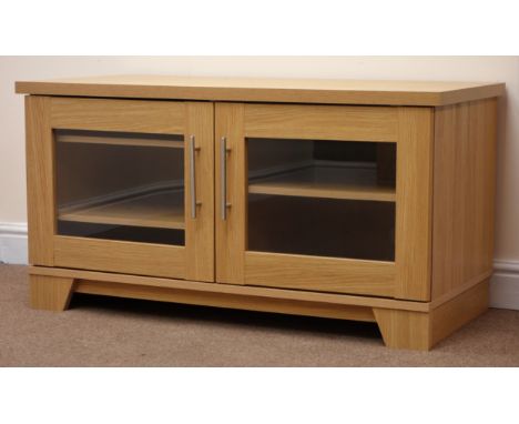 Light oak finish television cabinet, two glazed doors, plinth base, W108cm, H57cm, D52cm Condition Report Click here for furt