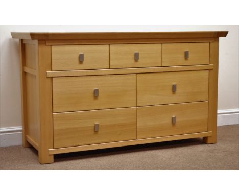 Ponsfords of Sheffield solid light oak chest, three short and four long drawers, stile supports, W128cm, H74cm, D50cm Conditi