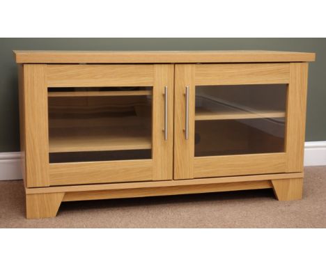 Light oak finish television cabinet, two glazed doors, plinth base, W108cm, H57cm, D52cm Condition Report Click here for furt