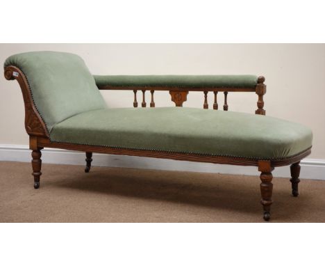 Edwardian walnut framed chaise longue, scrolled arm, turned supports, upholstered in a light green fabric, L160cm Condition R