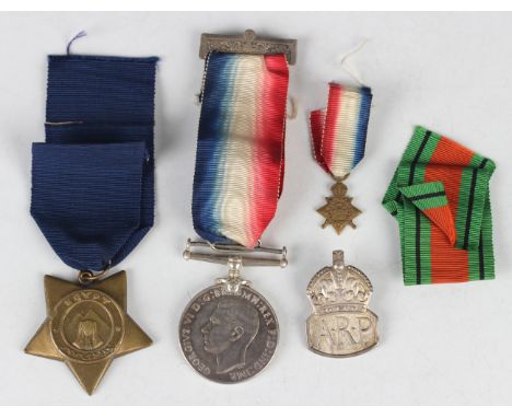 A Khedive's Star (undated, suspension bar lacking), a 1939-45 Defence Medal, Canadian silver issue, a silver ARP badge, Londo