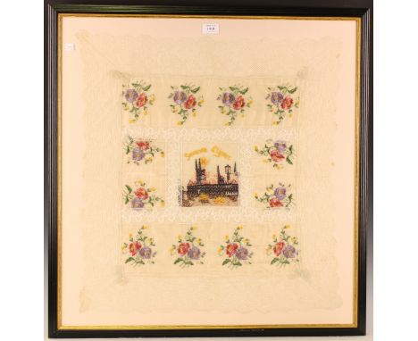 A First World War period silkwork panel with a central depiction of the burning of Les Halles within panels of flowers, appro