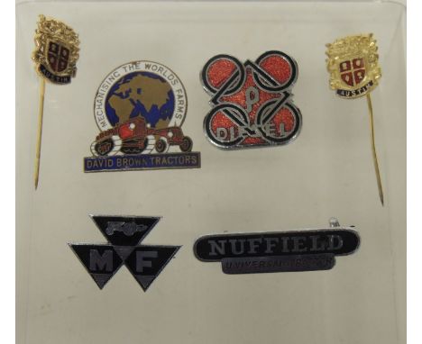 An enamelled brass lapel badge "David Brown Tractors", other lapel badges - Nuffield Universal Tractor; Diesel and MF and two