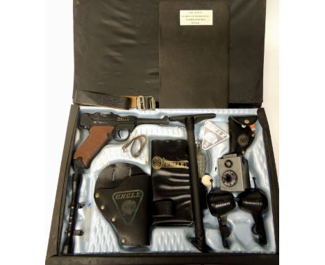 A Lone Star Man from UNCLE attache case and contents, the black plastic case containing Luger pistol, stock, telescopic sight