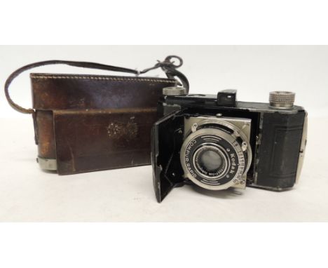 A Kodak folding camera with Compur-Rapid shutter and in original leather case