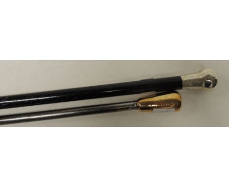 An ebonised wood walking stick with engraved silver top and original brass ferule, 89cms long together with a brass handled s