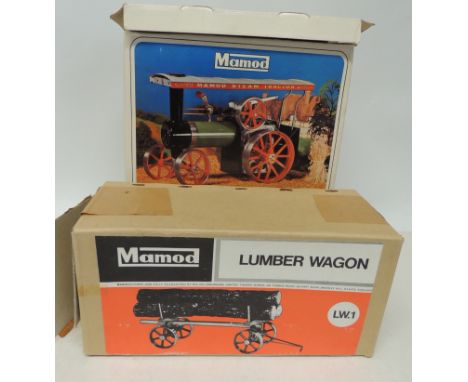 A Mamod Steam Tractor in original box complete with burner, funnel and steering pole together with a Lumber Wagon in box ++go