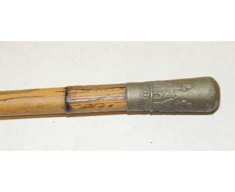 A Cambridgeshire Regiment swagger stick, the bamboo stick with metal top embossed with regimental badge, 65.5cms long