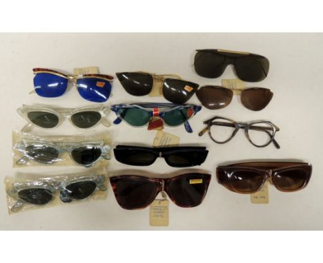 A quantity of vintage sunglasses, most with original labels attached, including two c.1950's Apine Sunstar with light blue ma