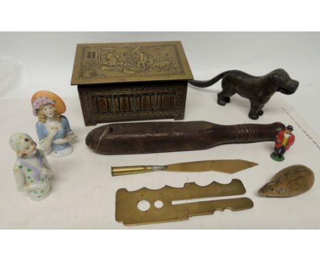 A Jacob & Cos novelty brass biscuit tin shaped as a coffer with sloping cover; two German porcelain half dolls; a brass polis