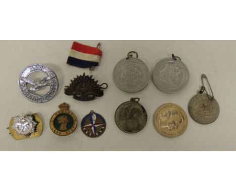 A Womens Land Army badge; Air Training Corps badge; Australian forces badges; enamelled brass 1951 Festival of Britain medall