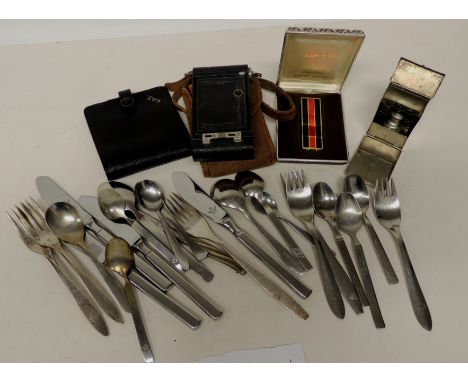 A quantity of Airline steel cutlery including PanAm, TWA and others; a Kodak folding Vest Pocket camera; a steel cased sterli