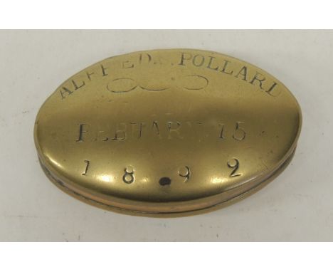 A Victorian oval brass snuff box the lid stamped "Alfred G Pollard February 15 1892" 7.25cms wide