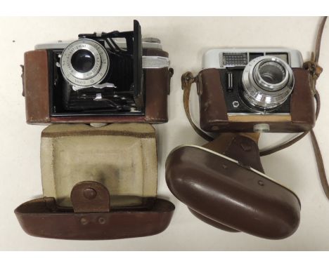 A Voigtlander Vito CLR camera with 2.8 50mm lens in leather case and together with a Zeiss Ikon Nettar folding camera in leat