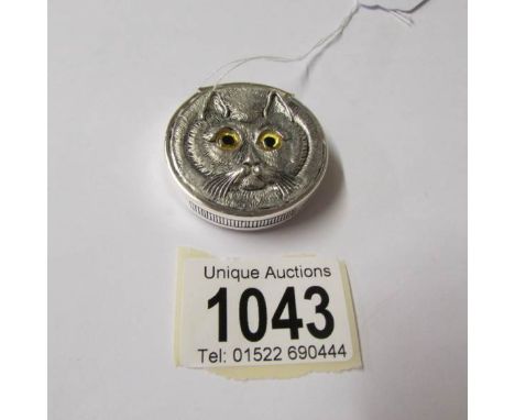 A silver vesta case in the form of a cat (Louis Wain style).