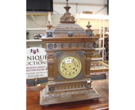 A large Edwardian oak mantle clock i.w.o. (missing fingers)