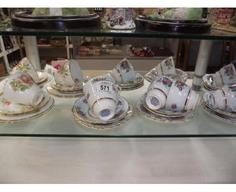A selection of Colclough floral tea cups, saucers and side plates and  Duchess Peach Rose trios