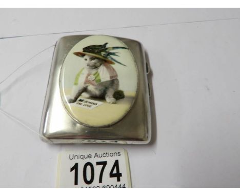 A silver case with an enamel pictorial image of a suffragette cat.