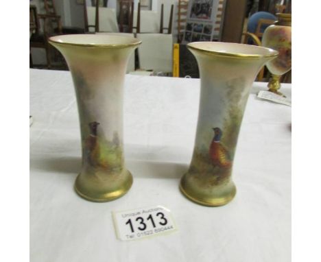 A pair of Royal Worcester vases hand painted with pheasants, signed H Stinton, year mark 1918.  12 cm tall.