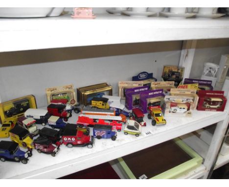 A shelf of diecast cars, some boxed