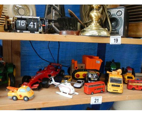 A shelf of die cast models.