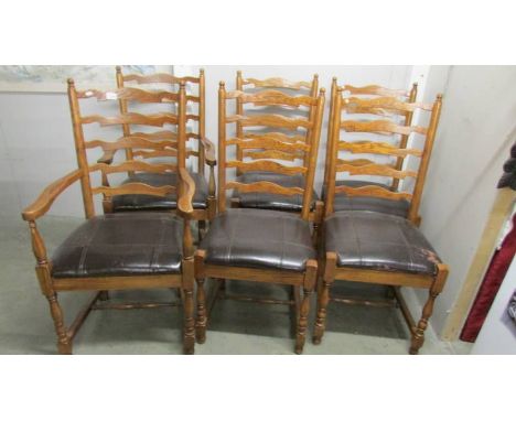A set of 6 good quality oak ladder back chairs comprising 2 carvers and 4 diners.