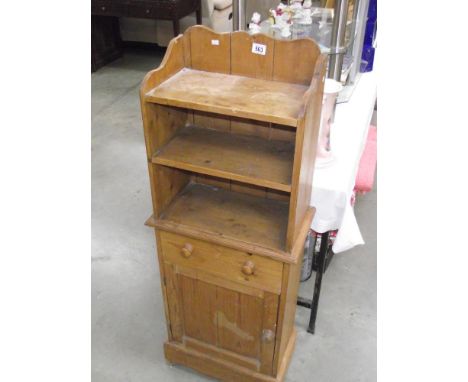 A solid pine cupboard back shelf unit