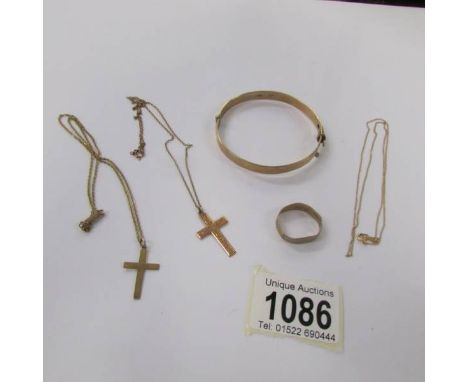 A 9ct gold bangle, 2 9ct gold crosses on unmarked chains and a fine 14k gold chain.