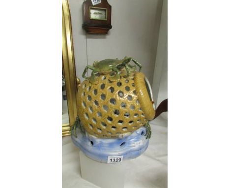 A ceramic crab pot with crabs.