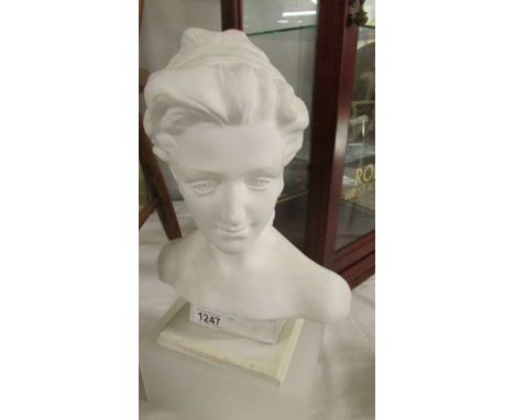 A ceramic bust of a lady.